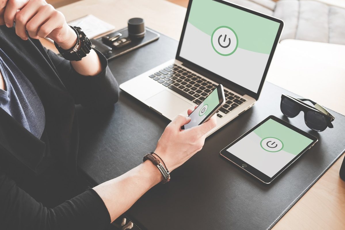 Technician checking WiFi signal during home renovation work